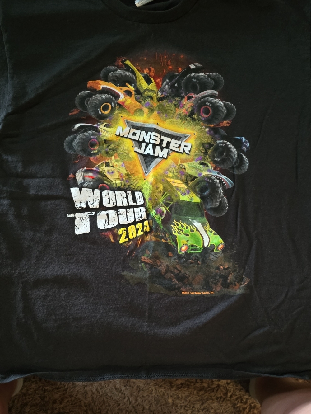 Delta Black Monster Jam World Tour 2024 Tee with Neon Green & Yellow Graphic